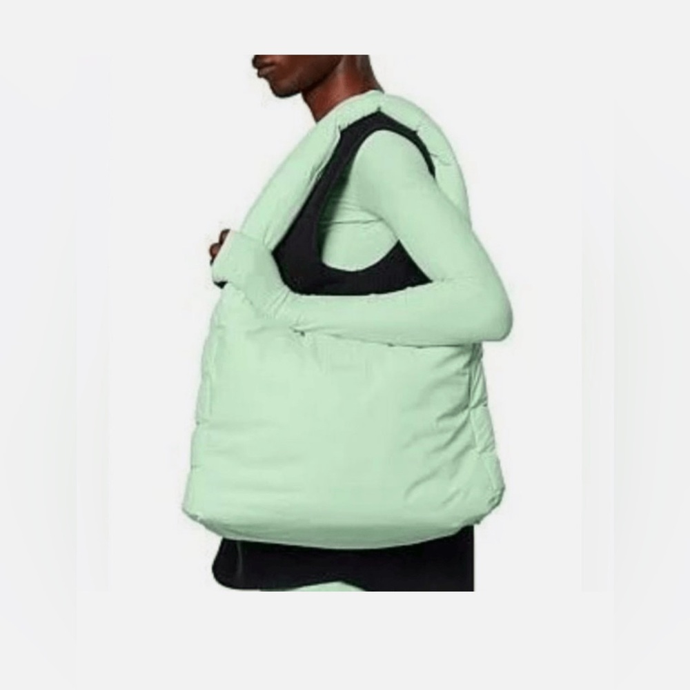 RAINS Mint Green Quilted Shoulder Bag with Crescent Shape and Wide Strap